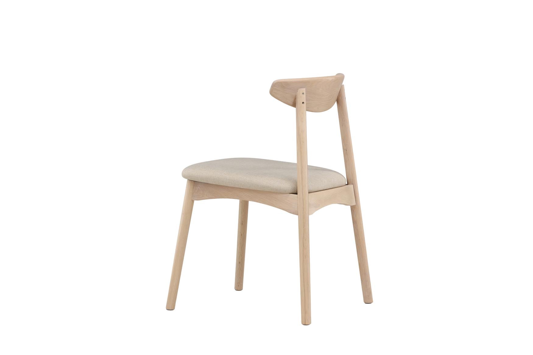 Der Ven Stuhl von Vind vereint elegantes Eichenholz mit ergonomischem Komfort und pflegeleichten Bezügen in verschiedenen Farben.