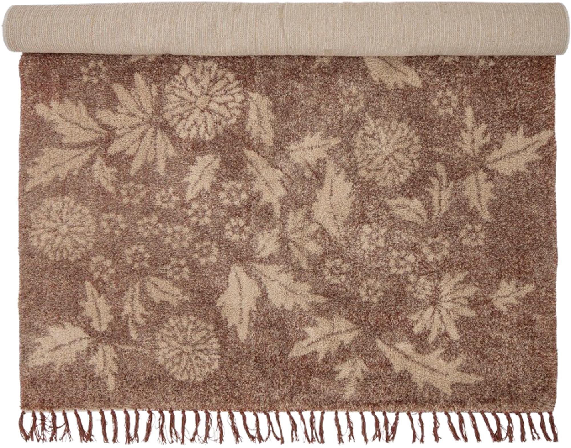 Der Malu Teppich in Braun aus Baumwolle besticht durch sein florales Design und passt perfekt zu jedem Einrichtungsstil.