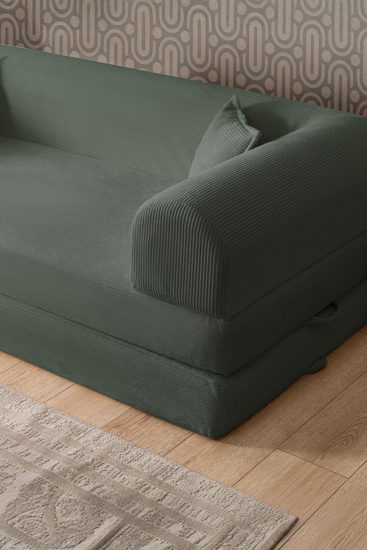 Grünes 3-Sitzer Schlafsofa Legom Eco von Hanah Home aus geripptem Cord-Plüschstoff mit zwei Kissen und abnehmbarem Bezug.