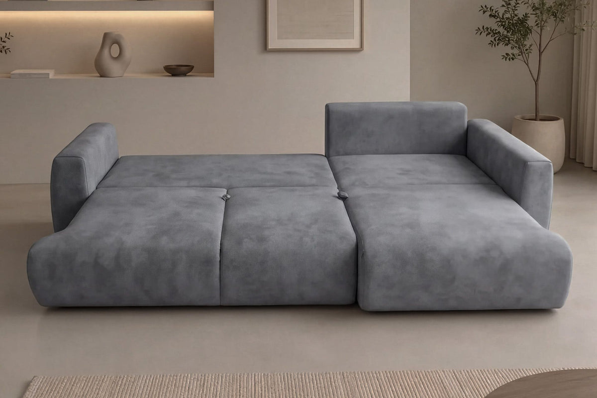 Graues Ecksofa rechts mit Schlaffunktion von Hanah Home, Bezug aus Polyester, Gestell aus Buchenholz und Spanplatte, mit zwei Kissen und Kunststoffbeinen.