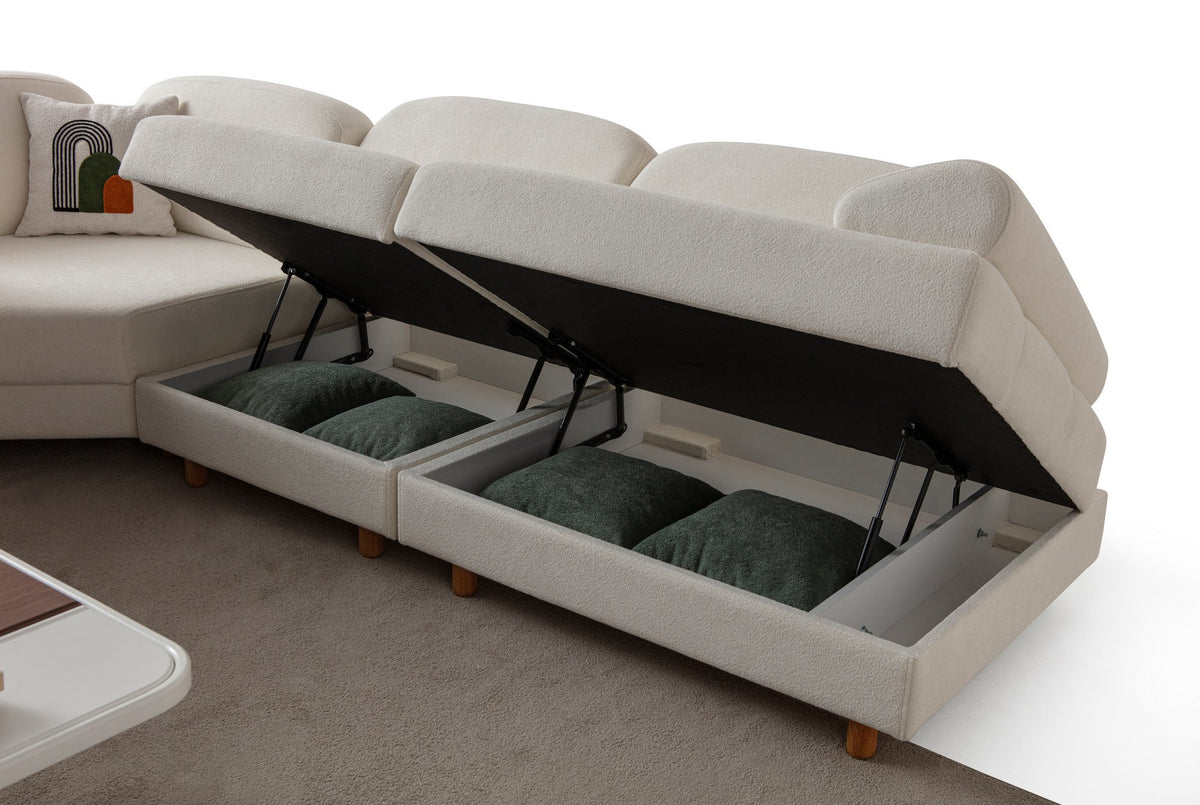 Weisses Eck-Schlafsofa Aries Modular M von Hanah Home mit Coco-Boucle-Stoff, Holzbeinen und Aufbewahrungstruhe, in L-Form.