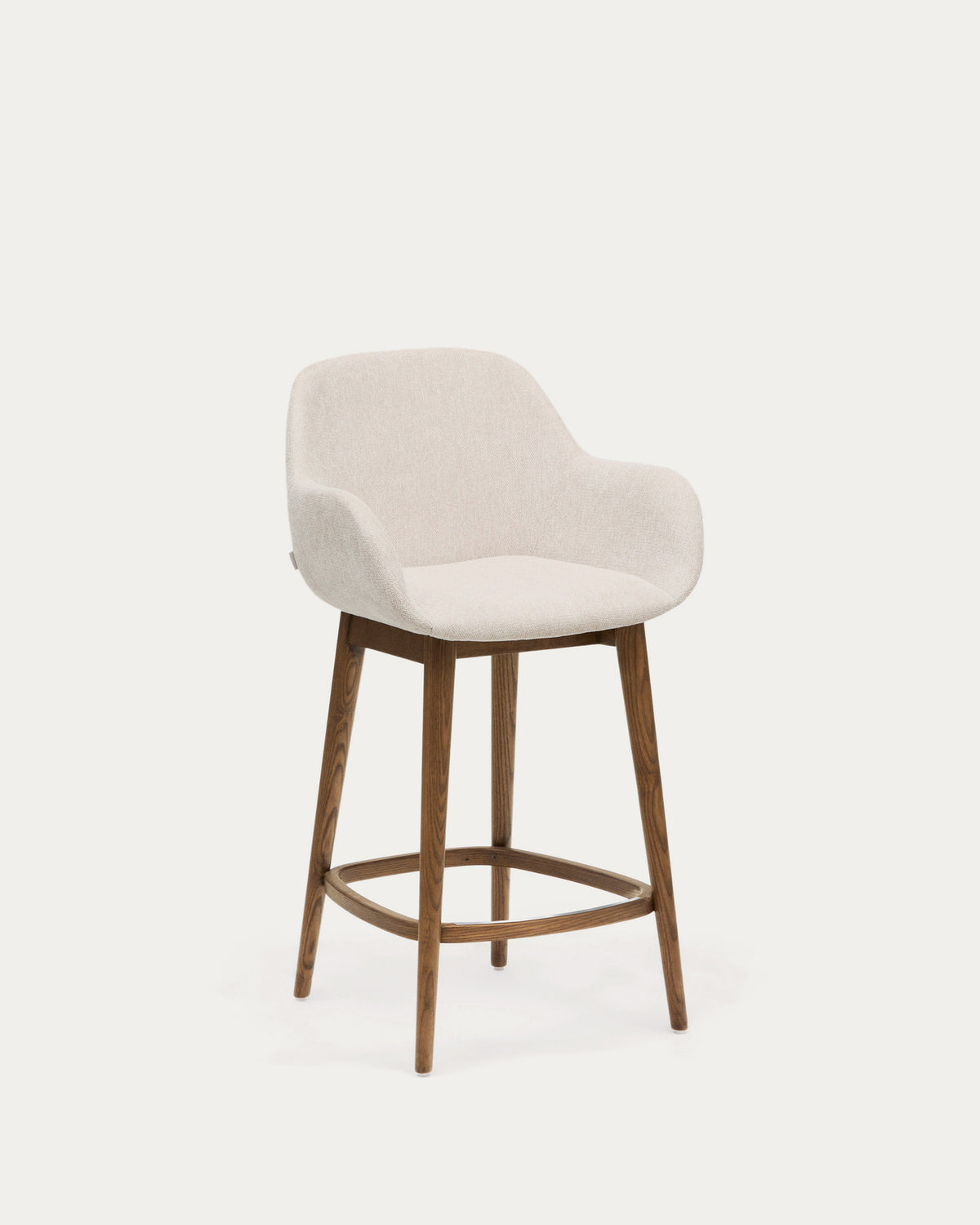 Beigefarbener Hocker Konna mit Beinen aus massivem Eschenholz, dunkles Finish 65 cm in Beige präsentiert im Onlineshop von KAQTU Design AG. Barstuhl ist von Kave Home
