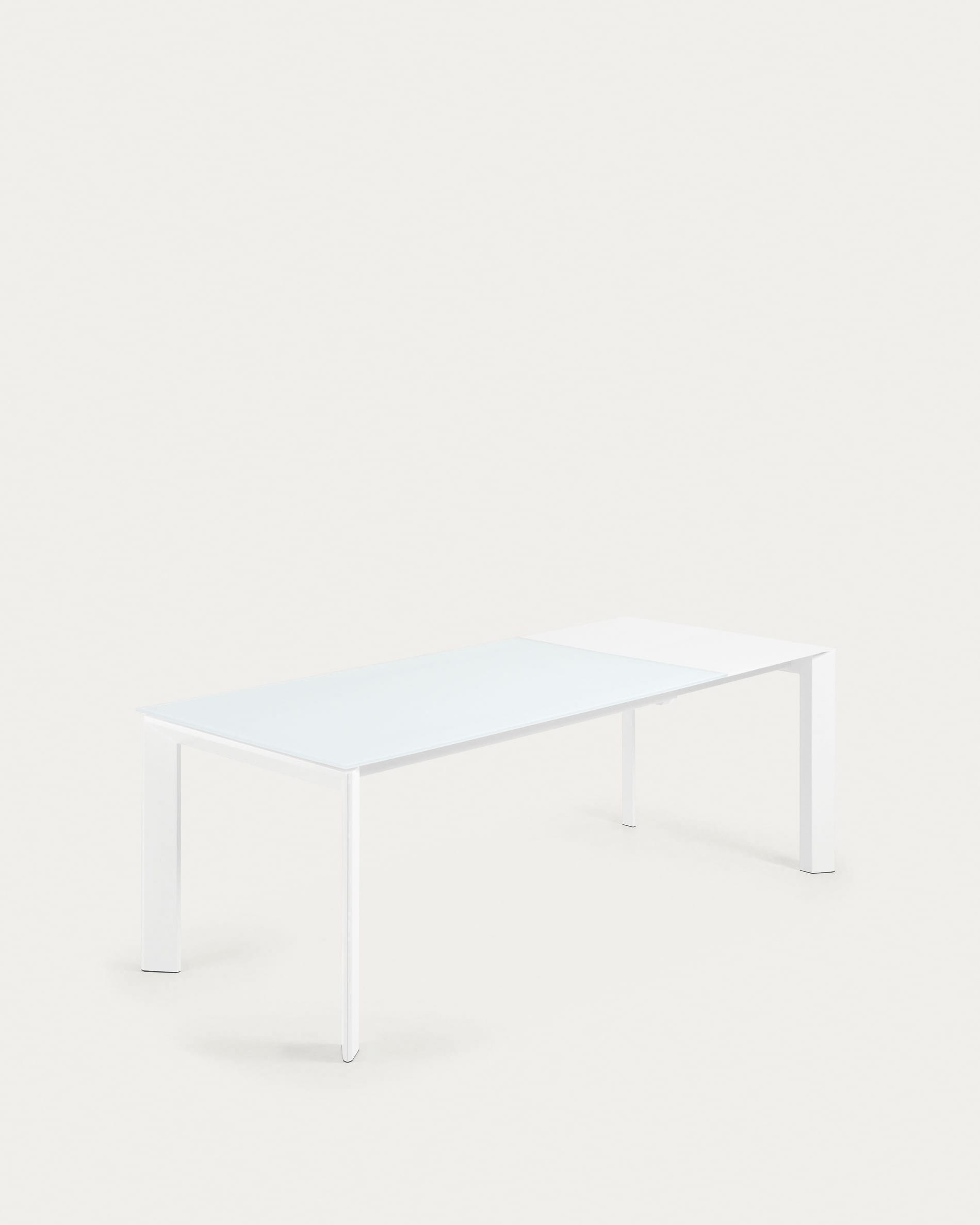 Eleganter Ausziehtisch mit Glasplatte und weißen Stahlbeinen, erweiterbar von 160 auf 220 cm.
