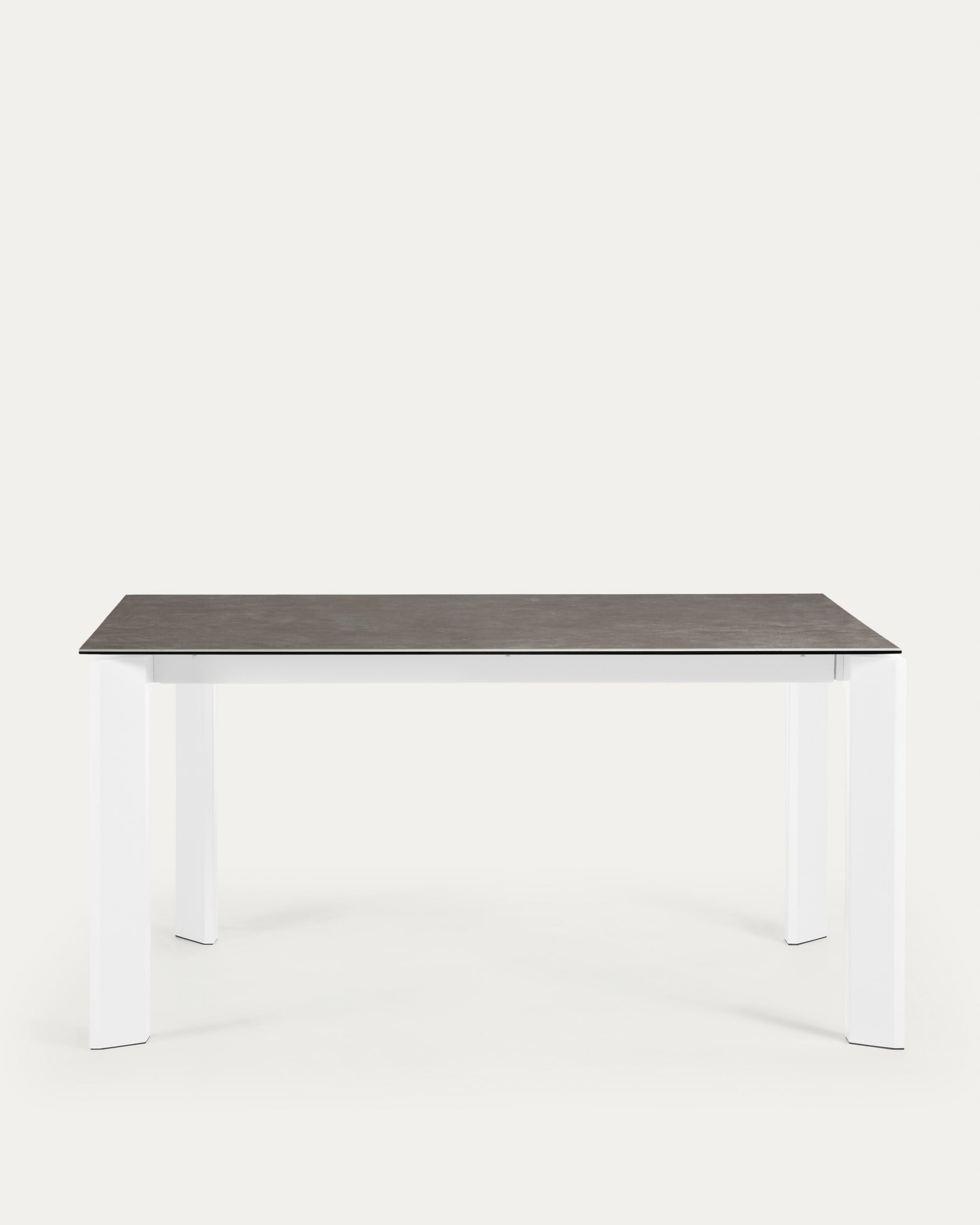 Moderner Ausziehtisch mit Feinsteinzeugplatte in Vulcano Ceniza Optik und weißen Stahlbeinen, 160-220 cm erweiterbar.