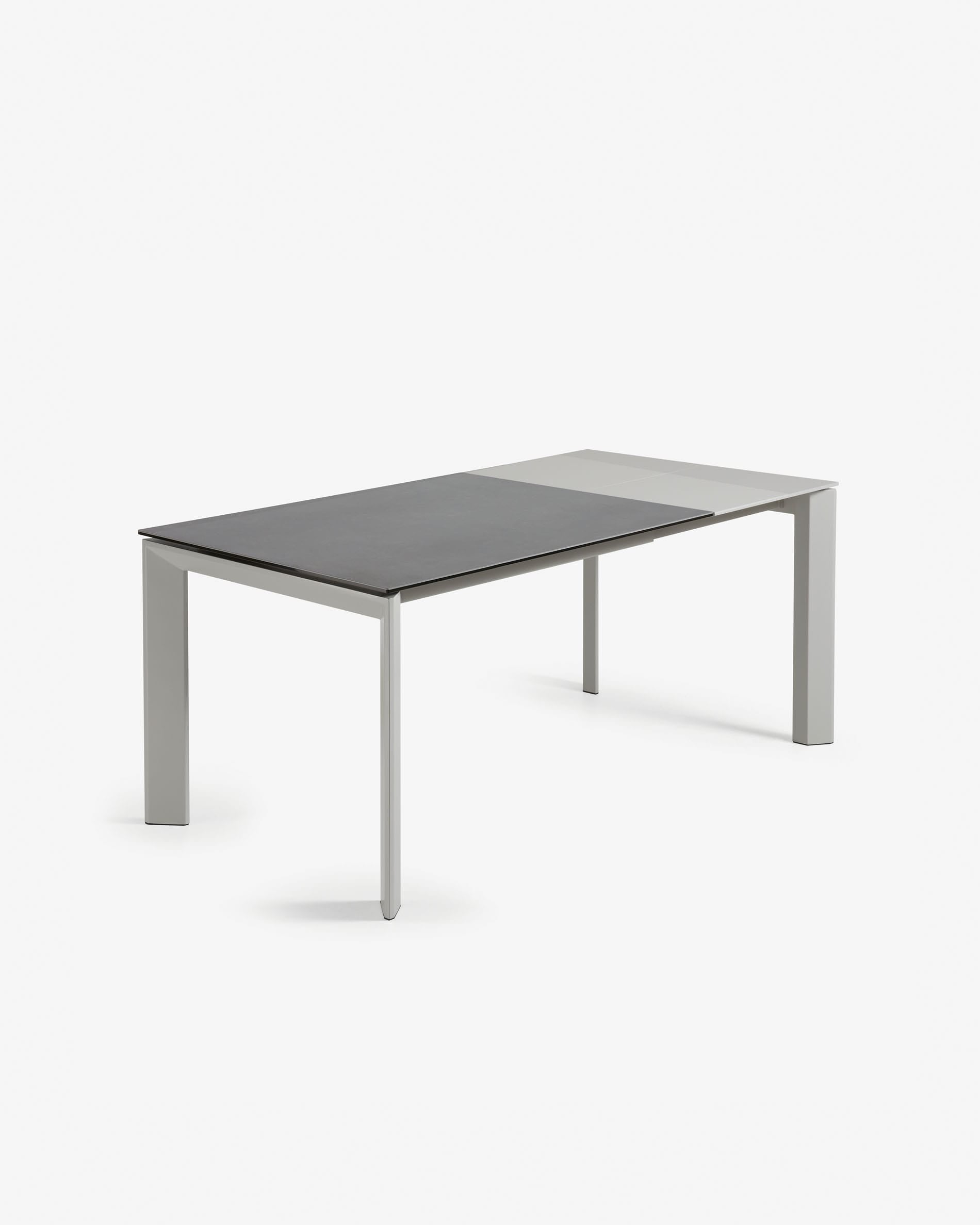 Moderner Ausziehtisch mit grauen Beinen und Feinsteinzeugplatte in Vulcano Roca Finish, erweiterbar von 120 auf 180 cm.