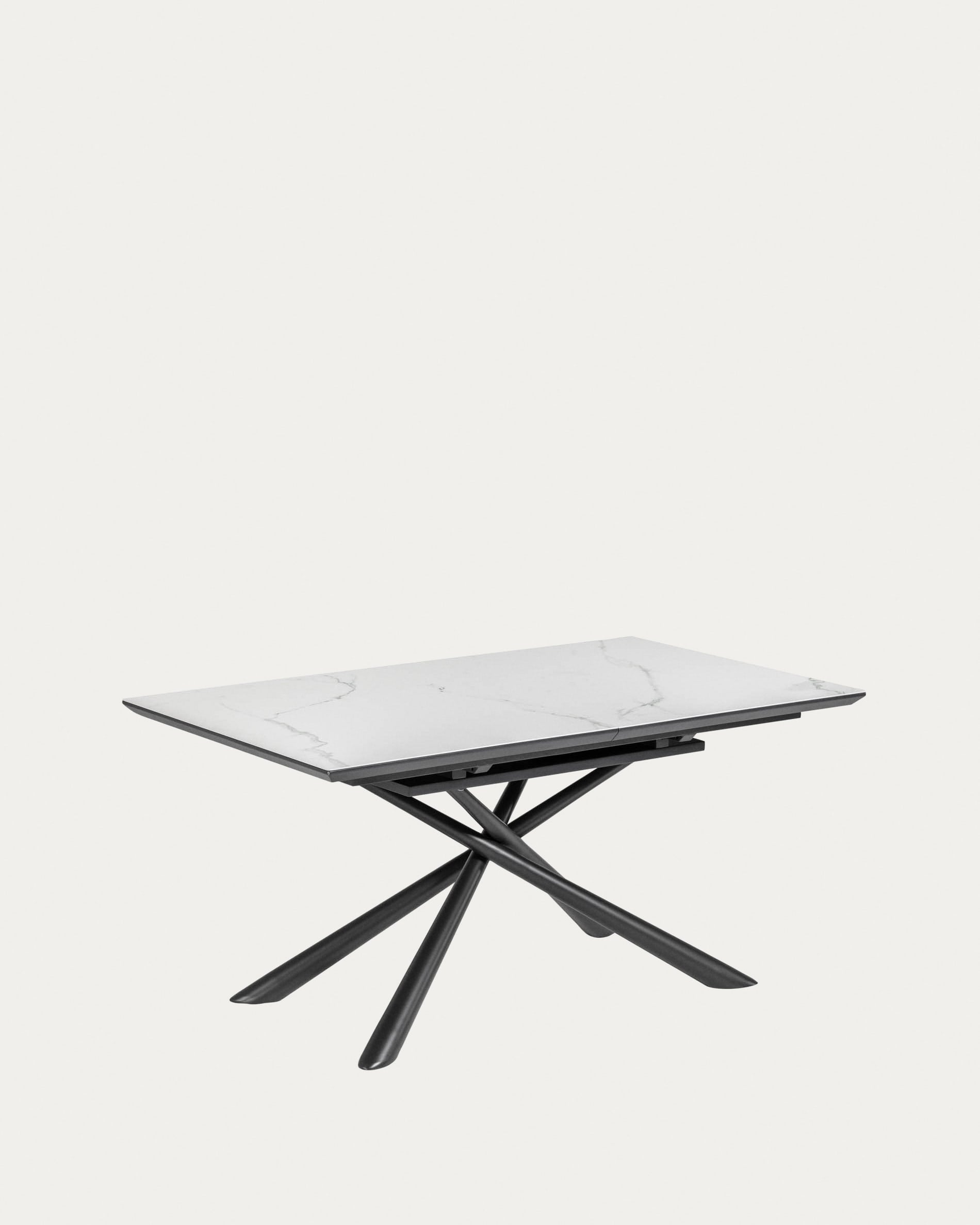 Eleganter, ausziehbarer Tisch mit weisser Platte und schwarzen Beinen, ideal für moderne Esszimmer.