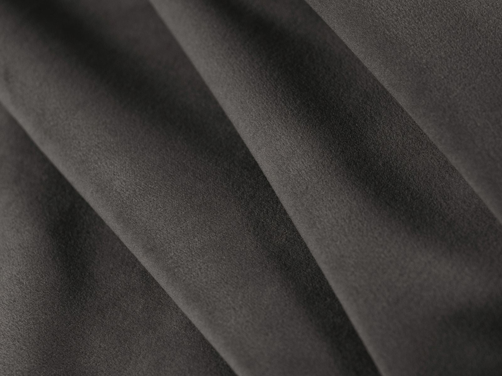 Stylisches 3-Sitzer Sofa Grena in elegantem Dunkelgrau, ideal für entspannte Abende und als praktisches Schlafsofa für Übernachtungsgäste.