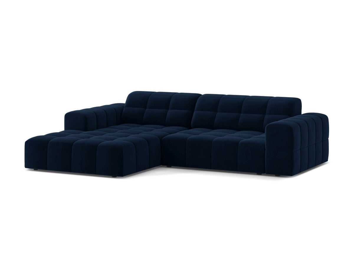 Ecksofa links Chicago in dunkelgrünem Samtstoff mit schwarzen Kunststoffbeinen, Massivholzrahmen und markanter Récamiere-Form.