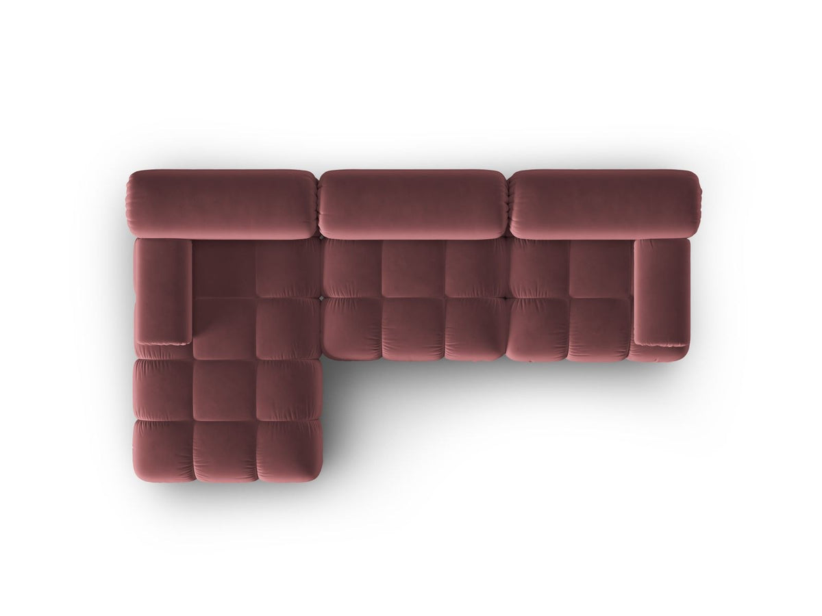 Modulares Ecksofa mit rosa Samtstoff, schwarzen Kunststoffbeinen und gepolsterter Récamiere, Ansicht von vorne links.