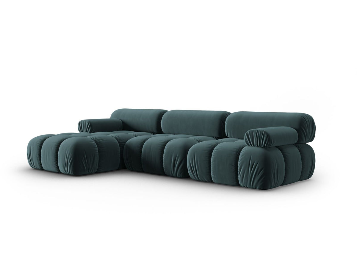 Modulares Ecksofa mit rosa Samtstoff, schwarzen Kunststoffbeinen und gepolsterter Récamiere, Ansicht von vorne links.