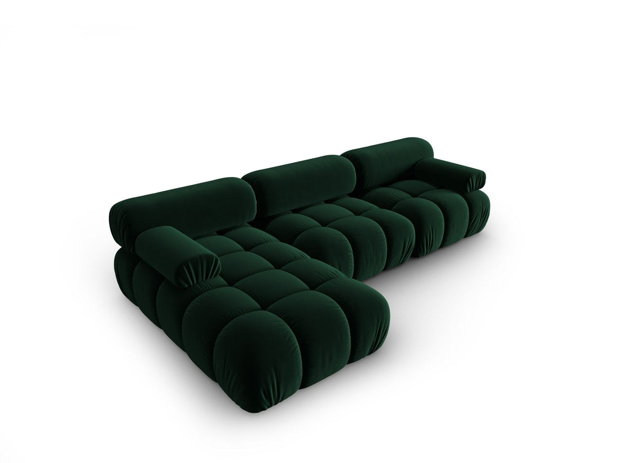 Modulares Ecksofa mit rosa Samtstoff, schwarzen Kunststoffbeinen und gepolsterter Récamiere, Ansicht von vorne links.