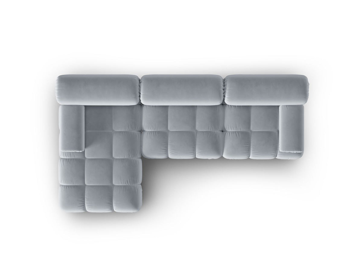 Modulares Ecksofa mit rosa Samtstoff, schwarzen Kunststoffbeinen und gepolsterter Récamiere, Ansicht von vorne links.