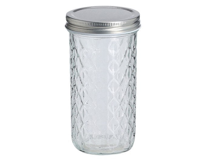 Transparentes Vorratsglas mit strukturierter Oberfläche und grauem Metalldeckel, zylindrische Form, 550 ml Fassungsvermögen, Höhe 16.2 cm.