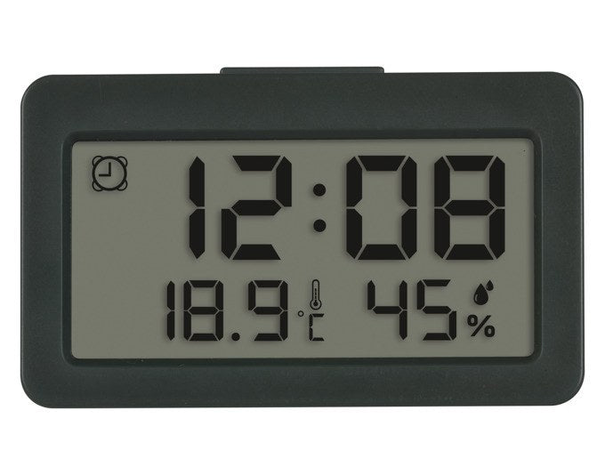 Digitaler TFA Mini-Wecker in Anthrazit mit Display für Uhrzeit, Innentemperatur und Luftfeuchtigkeit in kompakter, rechteckiger Bauform.