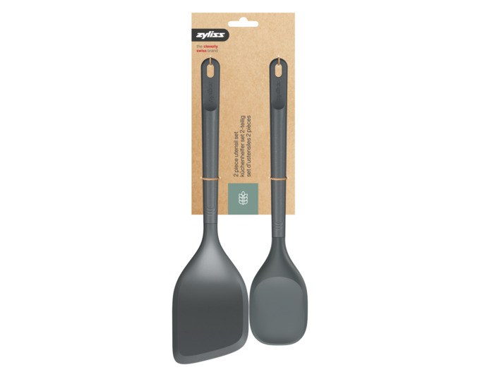 Zweiteiliges ZYLISS Küchenhelfer-Set in Grau: Spatellöffel mit Silikonkopf und abgewinkelter Pfannenwender, Griffe aus Weizenstrohmaterial.