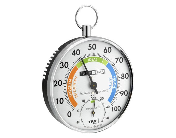 Analoges TFA Thermo-Hygrometer mit rundem, verchromtem Metallring, Zifferblatt für Temperatur und Luftfeuchtigkeit, Durchmesser 10.2 cm.