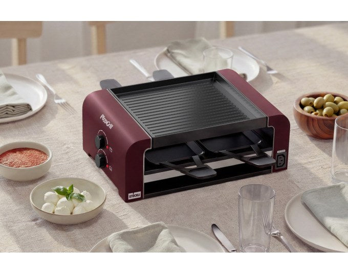 Roter STÖCKLI Tischgrill PizzaGrill 4 Connect mit vier antihaftbeschichteten Pfännchen, wendbarer Aluguss-Grillplatte und Teigausstecher.