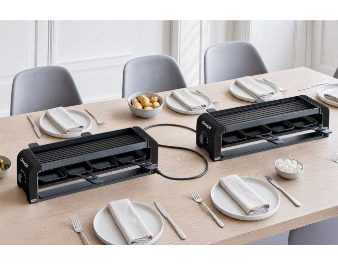 Schwarzer STÖCKLI Tischgrill CheeseGrill 4 Connect mit antihaftbeschichteten Pfännchen, Wende-Grillplatte und Parkdeck für Raclette und Grillgerichte.