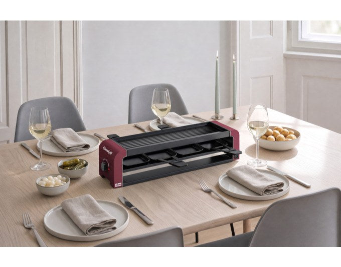 Roter STÖCKLI Tischgrill CheeseGrill 4 Connect mit vier antihaftbeschichteten Pfännchen und wendbarer Aluguss-Grillplatte für Raclette und Grillgerichte.