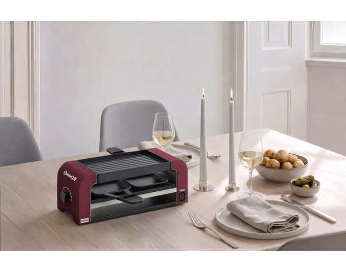 Produktfoto des STÖCKLI CheeseGrill 2 Connect in Merlot Red mit zwei antihaftbeschichteten Pfännchen und wendbarer Aluguss-Grillplatte.