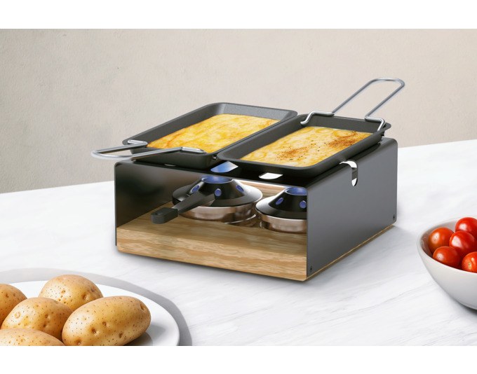 Schwarzes Caquelon aus Stahl-Email mit passendem Rechaud und sechs Käsefonduegabeln, rundes Fondue-Set von STÖCKLI mit 19 cm Durchmesser.
