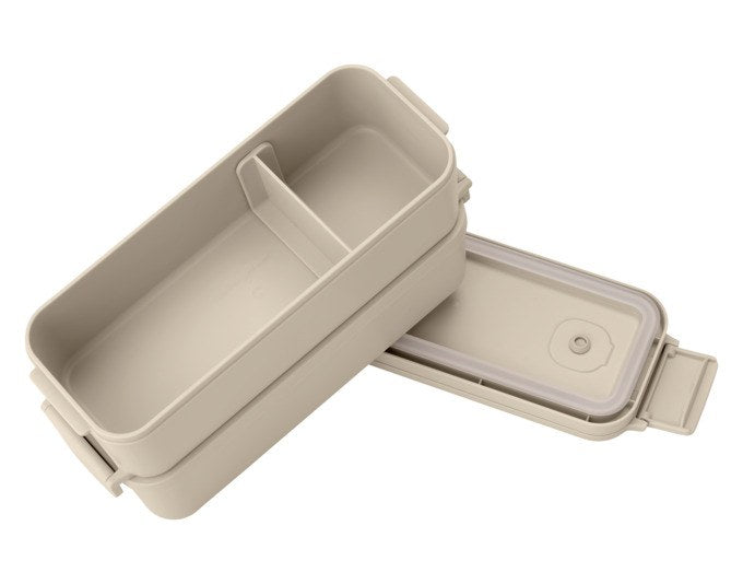 Beige-weisse Lunchbox aus Kunststoff mit Bento-Design, flexibler Trennwand, separatem Behälter und Clip-Deckel von BRABANTIA.