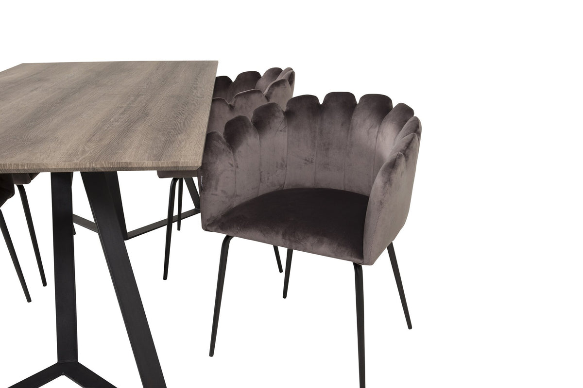 Foto zeigt graue Esszimmerstühle mit Stahlgestell und schwarzem Rahmen um einen rechteckigen MDF-Esstisch in Naturholzoptik, 180x90 cm.