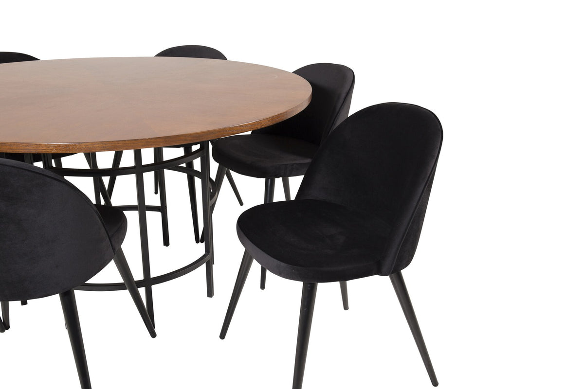 Runder Esstisch ⌀140 cm mit brauner Tischplatte aus MDF und Furnier, Stahlbeine, dazu zwei schwarze Velvet-Stühle mit pulverbeschichtetem Gestell.