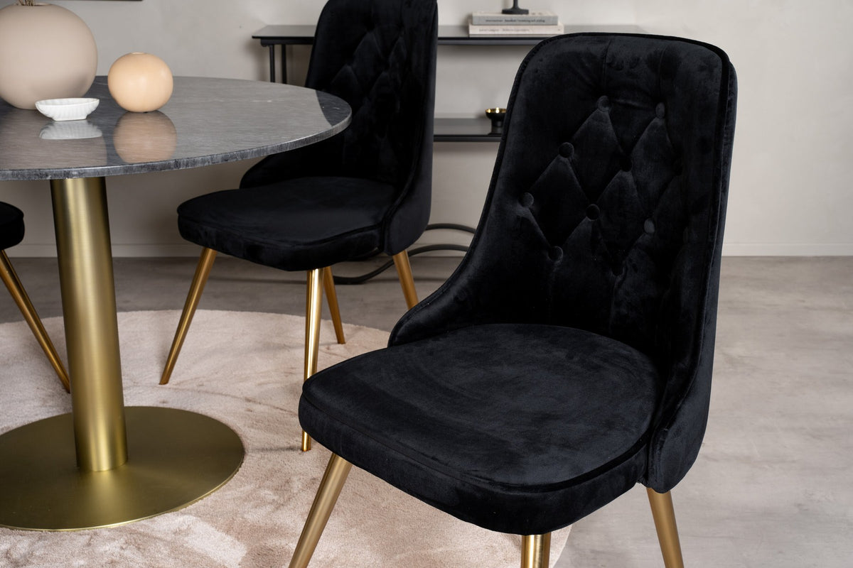 Rundes Esszimmerset Estelle mit schwarzer Marmortischplatte und gebürstetem Messinggestell, dazu vier Velvet Deluxe Stühle in moosgrünem Samt.