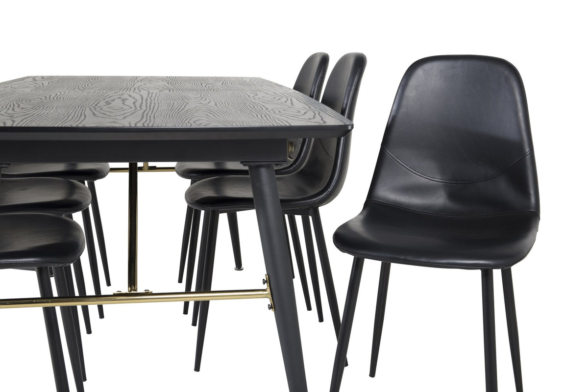 Rechteckiger Esstisch mit schwarzer MDF-Tischplatte und Stahlgestell, dazu zwei schwarze Esszimmerstühle mit gepolsterter Sitzfläche.
