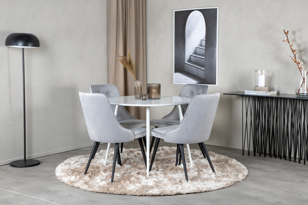 Plaza Bartischset: Hoher Esstisch mit weisser MDF-Tischplatte auf Stahlbeinen, dazu Velvet Deluxe Stühle mit schwarz pulverbeschichtetem Gestell.