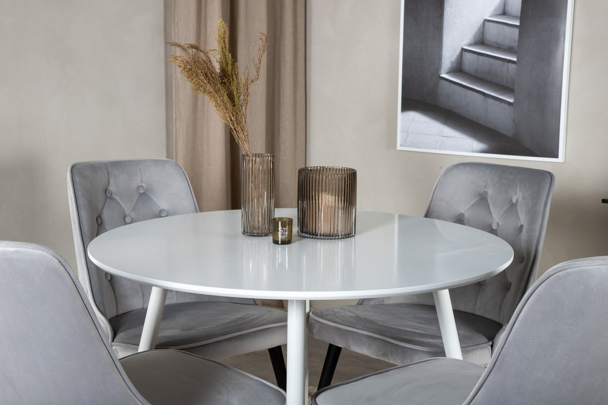 Plaza Bartischset: Hoher Esstisch mit weisser MDF-Tischplatte auf Stahlbeinen, dazu Velvet Deluxe Stühle mit schwarz pulverbeschichtetem Gestell.