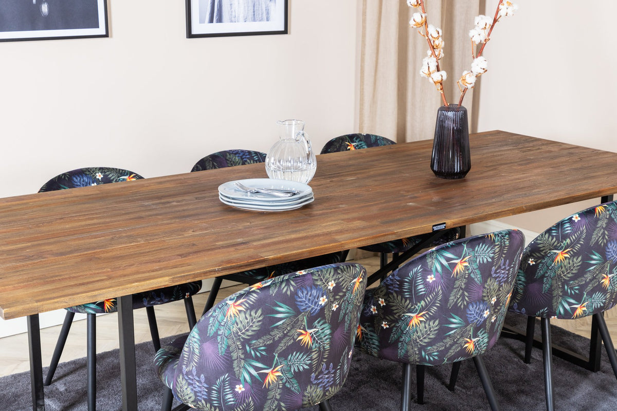 Schwarzes Esszimmerset Padang mit Teak-Tischplatte, Stahlgestell und gepolsterten Velvet-Stühlen mit schwarzem Samtbezug.