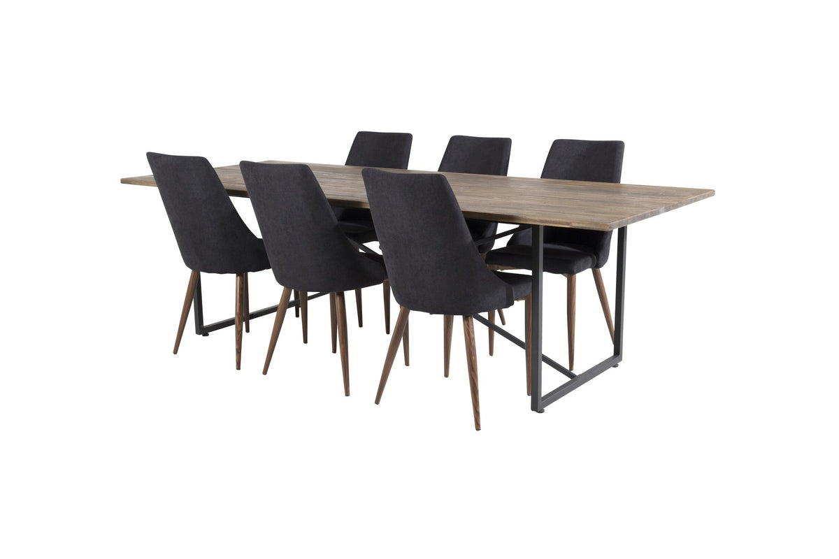 Zwei schwarze Esszimmerstühle mit Stahlgestell und Polsterbezug sowie rechteckiger Esstisch aus Teakholz mit Stahlbeinen, Farbe Natur.