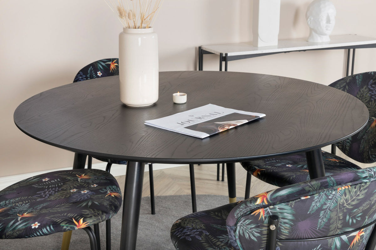Schwarzes Esszimmerset Dipp mit Vault Stühlen: Tisch mit MDF-Furnierplatte und Stahlbeinen, Stühle mit Polsterbezug und Stahlgestell.