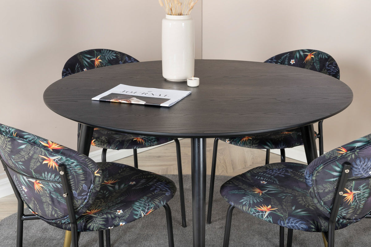 Schwarzes Esszimmerset Dipp mit Vault Stühlen: Tisch mit MDF-Furnierplatte und Stahlbeinen, Stühle mit Polsterbezug und Stahlgestell.