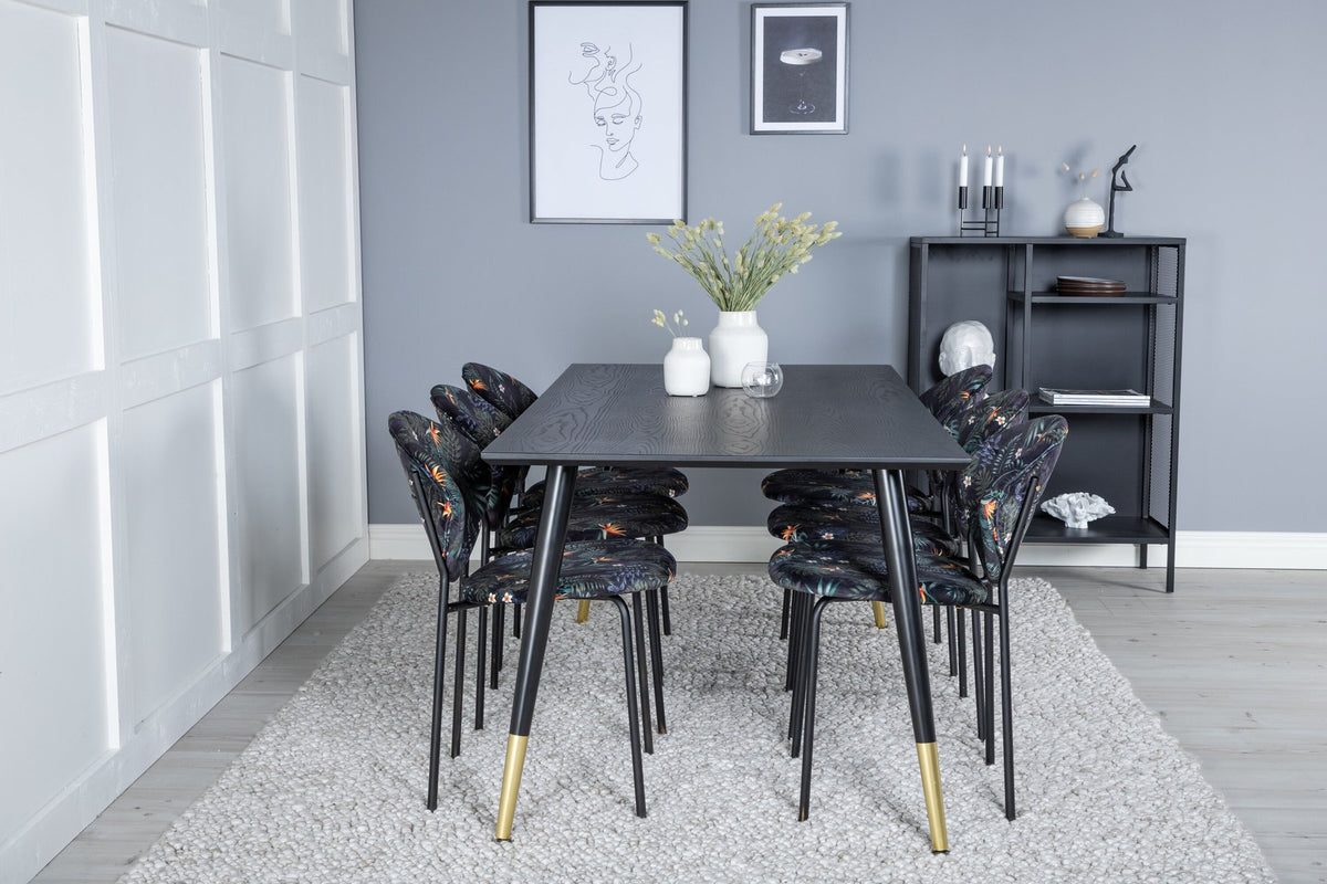 Schwarzes Esszimmerset Dipp mit Vault Stühlen: Tisch mit MDF-Furnierplatte und Stahlbeinen, Stühle mit Polsterbezug und Stahlgestell.