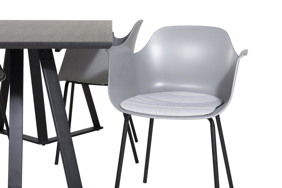 Esszimmerset Marina mit schwarzer MDF-Tischplatte, Stahluntergestell und gepolsterten Comfort-Stühlen mit grauem Polyesterbezug.