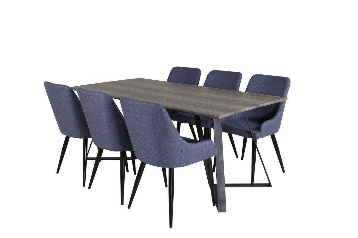 Zwei blaue Esszimmerstühle mit Stahlgestell und schwarz pulverbeschichteter Oberfläche neben einem rechteckigen MDF-Esstisch mit Stahlbeinen.