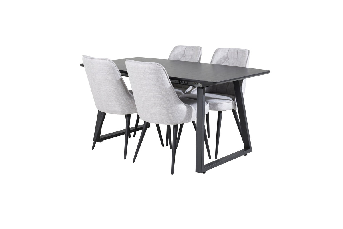 Rechteckiger Esstisch Inca in Schwarz mit ausziehbarer MDF-Platte und Stahlbeinen, daneben zwei gepolsterte Velvet-Esszimmerstühle in Grau von Venture Home.