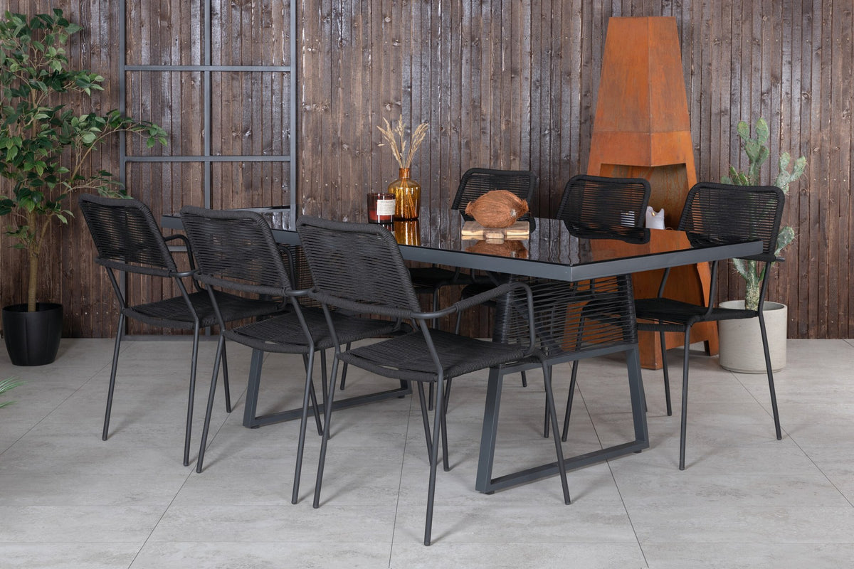 Esstisch Dallas mit sechs Stühlen Lindos, Gestell aus Aluminium und Geflecht in Schwarz, Tischplatte aus Glas, Outdoor-Set von Venture Home.
