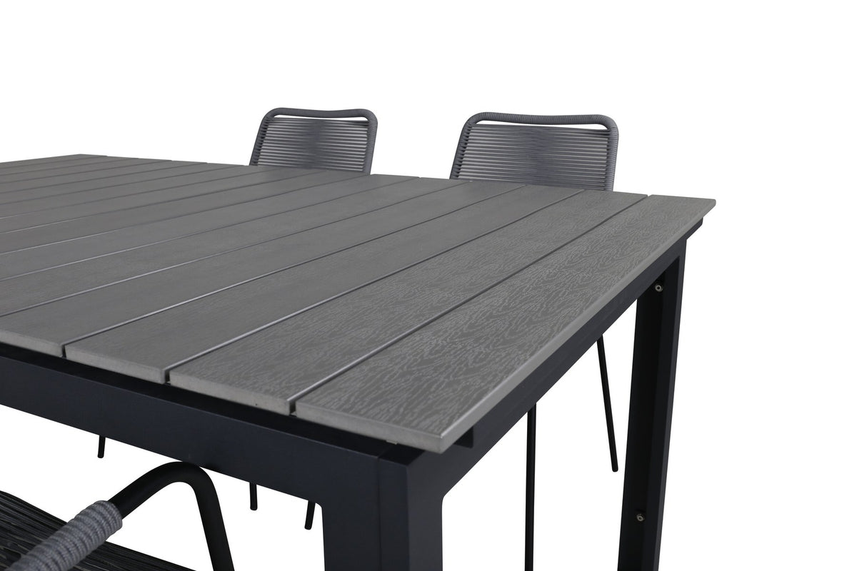 Rechteckiger Aintwood-Esstisch in Schwarz mit Stahlbeinen und zwei grauen Aintwood-Aluminium-Stühlen mit Pulverbeschichtung im Garten.