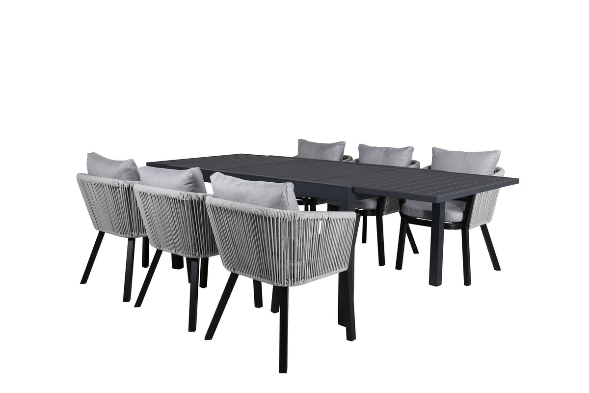 Gartentischset aus Aluminium: ausziehbarer Marbella Tisch mit schwarzem Gestell und 4 Virya Stühlen mit grauem Kissen im Aussenbereich.