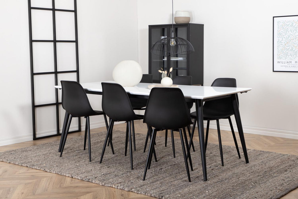 Esszimmerset Jimmy mit ausziehbarem Tisch aus weissem HPL und MDF, schwarzen Stahlbeinen sowie sechs schwarzen Polar-Stühlen mit Kunststoffsitz.