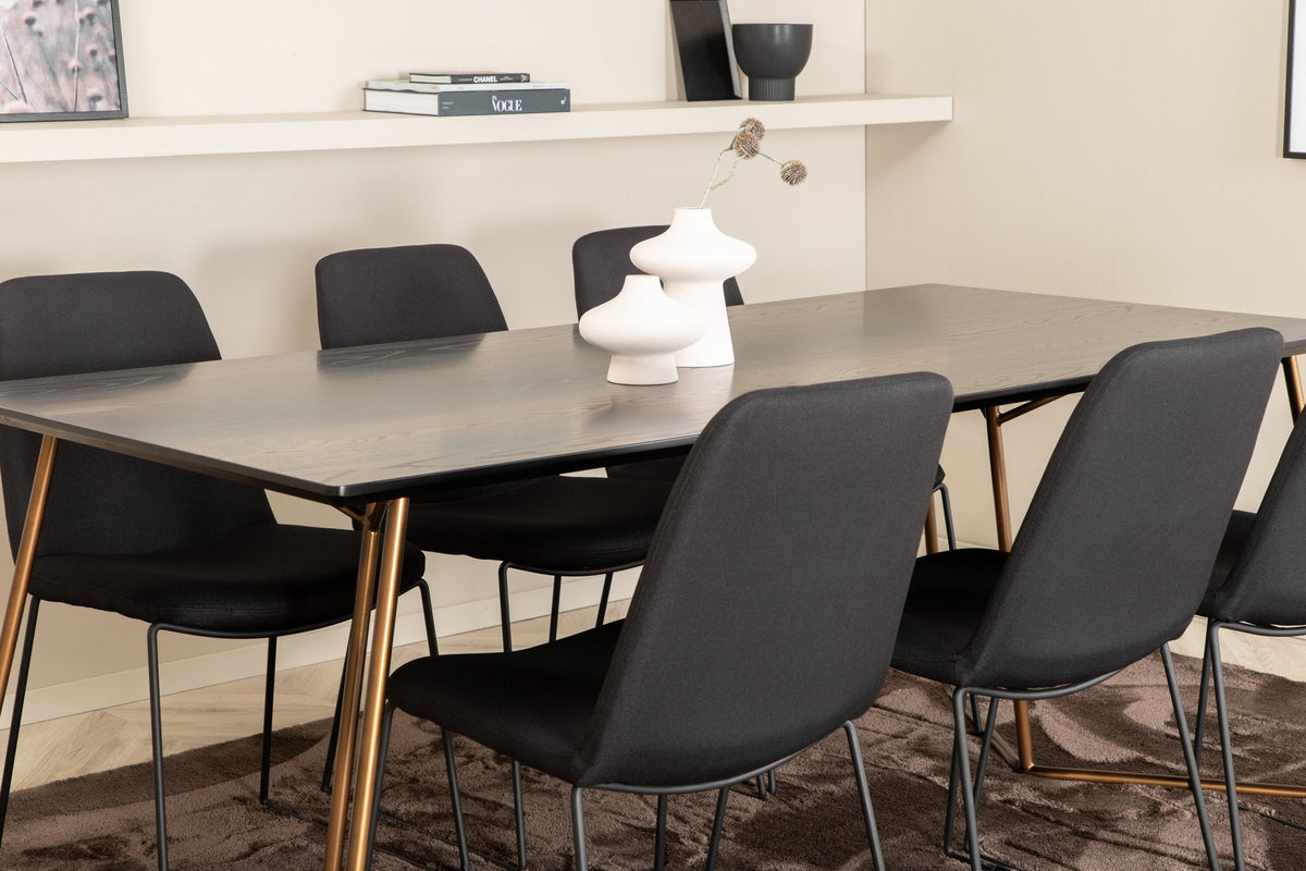 Schwarzes Esszimmerset Petra von Venture Home: Esstisch mit Tischplatte aus MDF und Furnier sowie sechs Stühle Muce mit Stahlbeinen.