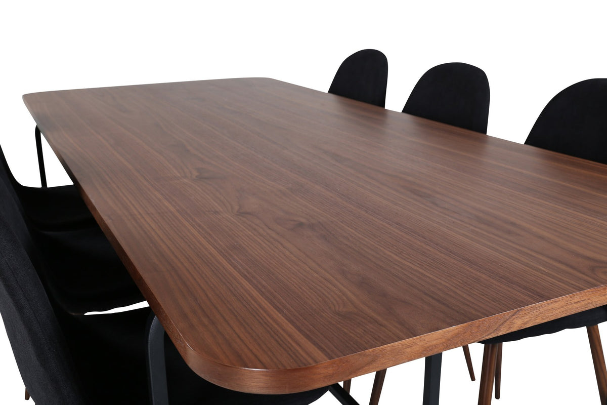 Rechteckiger Esstisch mit Nussbaum-Furnierplatte aus MDF und schwarzem Stahluntergestell, umgeben von sechs gepolsterten Polar Stühlen mit schwarzem Polyesterbezug.