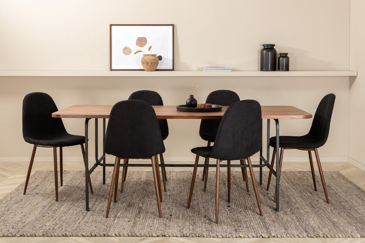Rechteckiger Esstisch mit Nussbaum-Furnierplatte aus MDF und schwarzem Stahluntergestell, umgeben von sechs gepolsterten Polar Stühlen mit schwarzem Polyesterbezug.