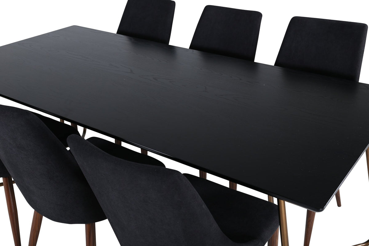 Rechteckiger Esstisch aus schwarzem MDF mit Furnier und Stahlbeinen, dazu zwei Esszimmerstühle mit schwarzer Sitzfläche und Metallgestell.