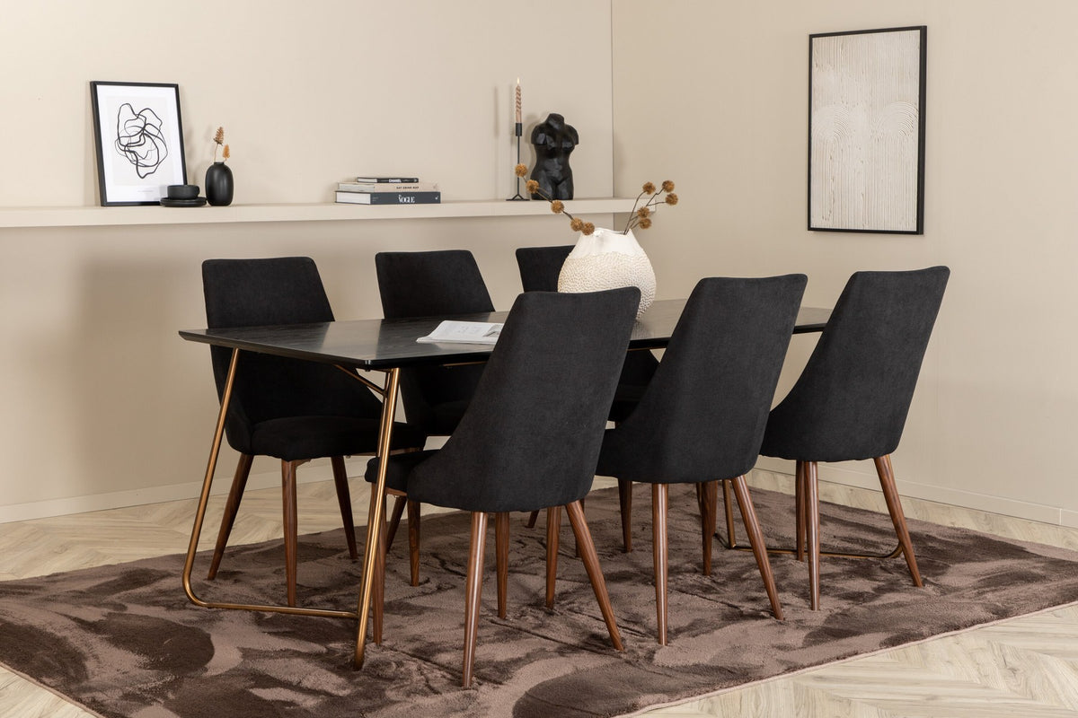 Rechteckiger Esstisch aus schwarzem MDF mit Furnier und Stahlbeinen, dazu zwei Esszimmerstühle mit schwarzer Sitzfläche und Metallgestell.