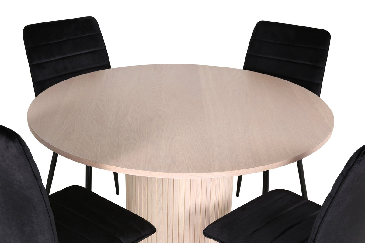 Rundes Esszimmerset Bianca mit schwarzer MDF-Tischplatte, Rippengestell und vier Windu-Stühlen mit schwarzem Samtbezug und Stahlbeinen.